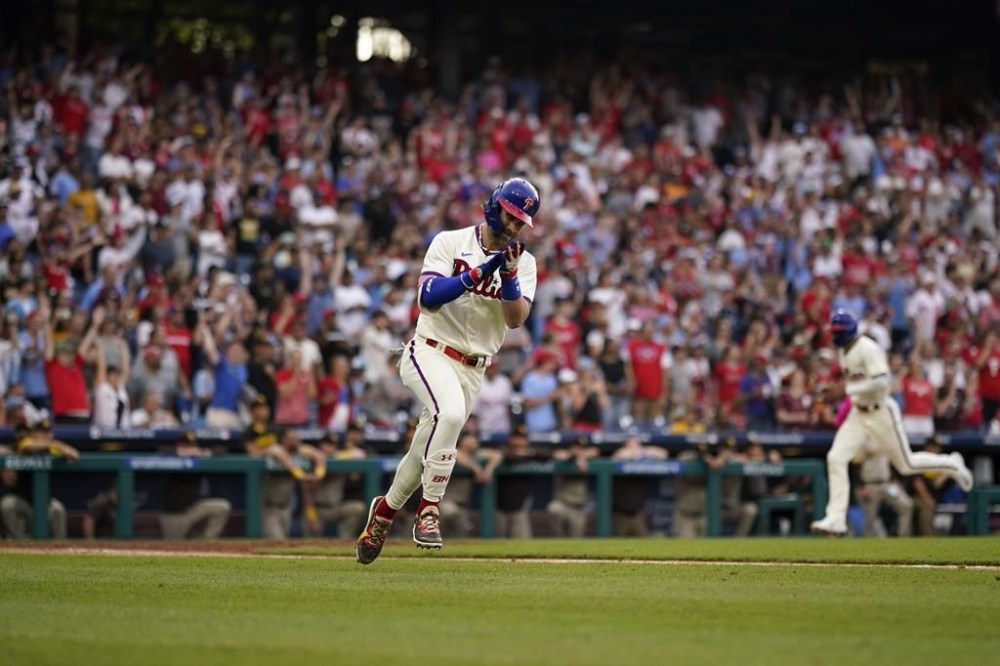 Philadelphia Phillies' Bryce Harper reacts after hitting a run-scoring single during the 10th inning of a baseball game against the San Diego Padres, Sunday, July 16, 2023, in Philadelphia. (AP Photo/Matt Slocum)