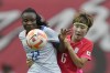 Haiti's Roselord Borgella, vies for the ball against South Korea's Lim Seon-joo during a friendly soccer match between South Korea and Haiti at Seoul World Cup Stadium in Seoul, South Korea, Saturday, July 8, 2023. South Korea will compete with Germany, Morocco and Colombia in the Group H and Haiti will compete with England, Denmark and China in the Group D at the FIFA Women's World Cup. (AP Photo/Lee Jin-man)
