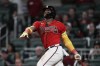 FILE - Atlanta Braves' Ronald Acuna Jr. watches his two-run home against the Miami Marlins during the seventh inning of a baseball game Friday, June 30, 2023, in Atlanta. Acuña Jr. is on pace to do more than just become the fifth player in baseball history to hit 40 homers and steal 40 bases in the same season. (AP Photo/John Bazemore, File)