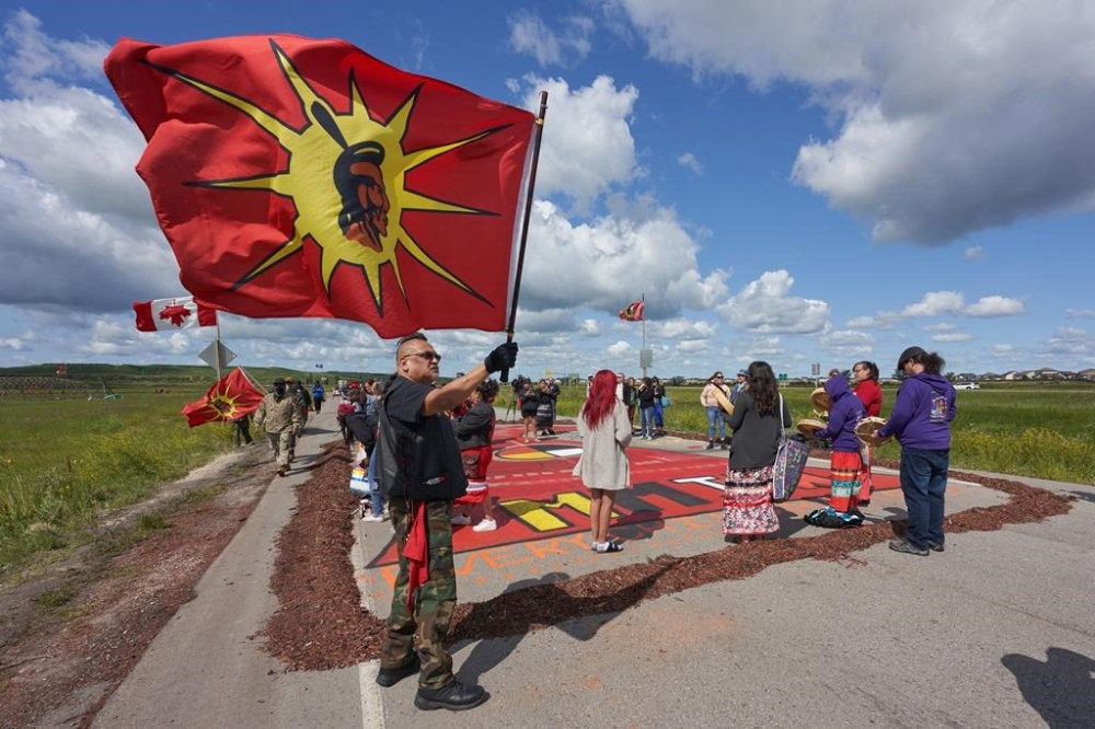 Indigenous leaders say a search of a Winnipeg-area landfill for the remains of women can be done safely and must go ahead. Activists blockade the main road into the Brady Road landfill, just outside of Winnipeg on Monday, July 10, 2023. THE CANADIAN PRESS/David Lipnowski