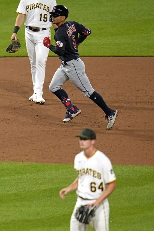 Cleveland Guardians' Andres Gimenez (0) rounds the bases after hitting a two-run home run off Pittsburgh Pirates starting pitcher Quinn Priester (64) during the sixth inning of a baseball game in Pittsburgh, Monday, July 17, 2023. (AP Photo/Gene J. Puskar)