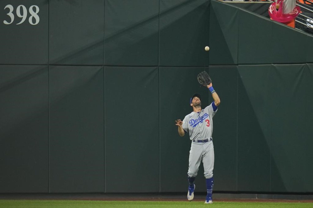 Los Angeles Dodgers shortstop Chris Taylor makes a catch for the final out of a baseball game against the Baltimore Orioles, Monday, July 17, 2023, in Baltimore. The Dodgers won 6-4. (AP Photo/Julio Cortez)