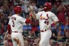 St. Louis Cardinals' Paul Goldschmidt (46) and Dylan Carlson (3) celebrate after scoring on a two-run double by Nolan Arenado during the sixth inning of a baseball game against the Miami Marlins Monday, July 17, 2023, in St. Louis. (AP Photo/Jeff Roberson)