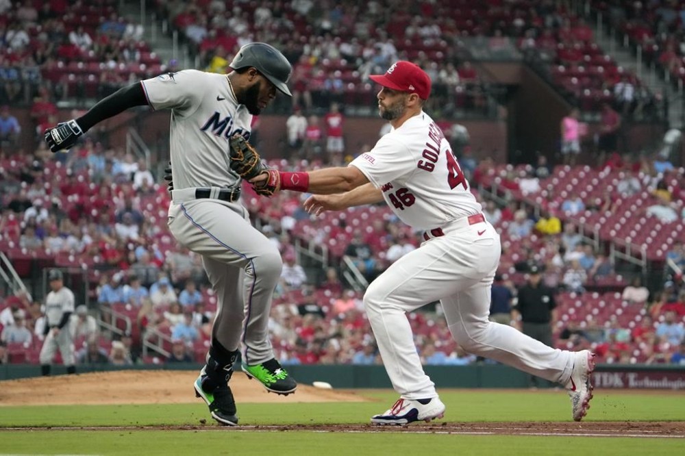 Miami Marlins' Bryan De La Cruz, is tagged out by St. Louis Cardinals first baseman Paul Goldschmidt to end the top of the fourth inning of a baseball game Monday, July 17, 2023, in St. Louis. (AP Photo/Jeff Roberson)