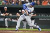 Los Angeles Dodgers' Max Muncy swings at a pitch from the Baltimore Orioles during the fourth inning of a baseball game, Monday, July 17, 2023, in Baltimore. (AP Photo/Julio Cortez)