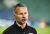 FILE - Wales coach Ryan Giggs talks to media prior to the UEFA Nations League soccer match between Bulgaria and Wales at Vassil Levski national stadium in Sofia, Bulgaria, Wednesday, Oct. 14, 2020. Former Manchester United winger Ryan Giggs' retrial on charges of domestic violence will not go ahead this month after prosecutors pulled out of the case. Giggs, one of the greatest modern-day players in British soccer, was due to go on trial for a second time starting July 31, 2023, accused of controlling or coercive behavior toward his former girlfriend, Kate Greville, between August 2017 and November 2020. (AP Photo/Anton Uzunov, File)