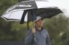 United States' Scottie Scheffler walks on the 2nd fairway as light rain falls during a practice round for the British Open Golf Championships at the Royal Liverpool Golf Club in Hoylake, England, Tuesday, July 18, 2023. The Open starts Thursday, July 20. (AP Photo/Peter Morrison)