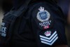 A Surrey police department logo is seen on an officer's uniform in Surrey, B.C., on Wednesday, Aug. 31, 2022. The head of the National Police Federation has sent an open letter to British Columbia Premier David Eby, criticizing the province's lack of police funding leading to staff shortages and unfairly blaming the Mounties for not filling their vacancies. THE CANADIAN PRESS/Darryl Dyck