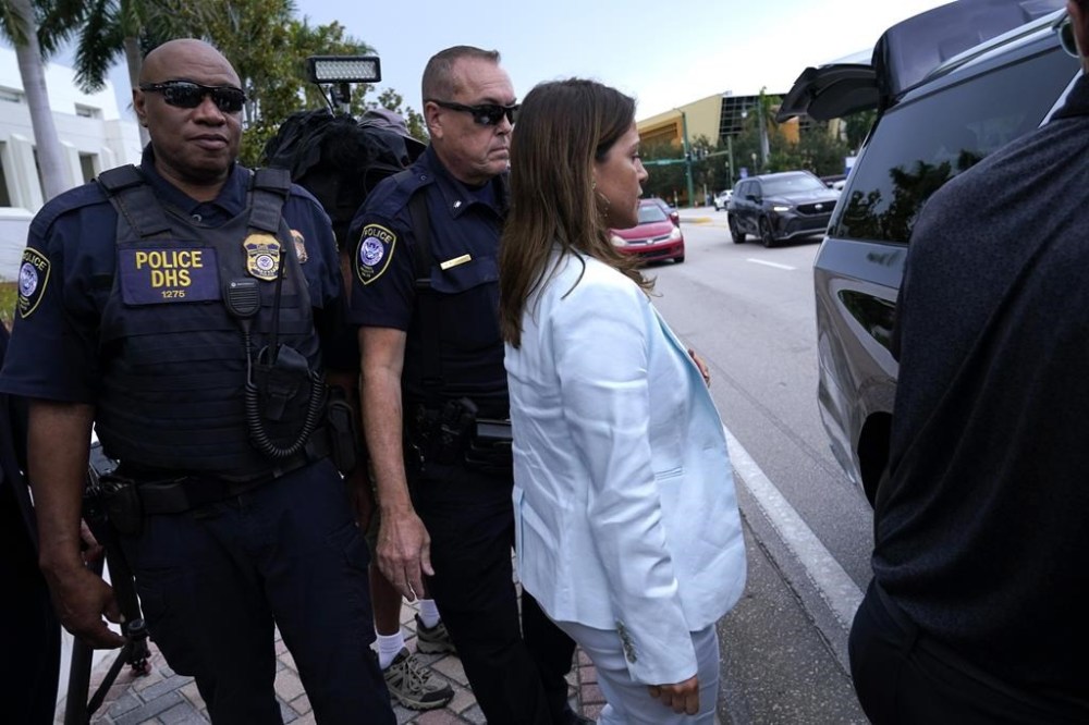 Defense attorney Sasha Dadan, right, who is representing Walt Nauta, a valet to former President Donald Trump, leaves the Alto Lee Adams Sr. U.S. Courthouse after a pretrial conference to discuss procedures for handling classified information, Tuesday, July 18, 2023, in Fort Pierce, Fla. Nauta is charged with helping the ex-president hide classified documents the Justice Department wanted back. (AP Photo/Lynne Sladky)