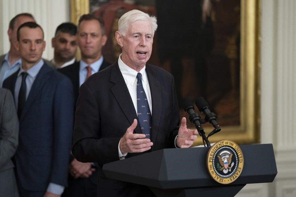 FILE -Atlanta Braves President and CEO Terry McGuirk speaks during an event celebrating the 2021 World Series champion Atlanta Braves, in the East Room of the White House, Monday, Sept. 26, 2022, in Washington. Atlanta Braves executives say business will continue as usual under a new ownership structure following a spinoff from Liberty Media. Perhaps most notable is fans will be able to purchase stock in the newly created Atlanta Braves Holdings, Inc., and become owners of the team. (AP Photo/Evan Vucci, File)