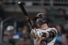 Arizona Diamondbacks' Christian Walker (53) watches his three-run home run in the sixth inning of a baseball game against the Atlanta Braves Tuesday, July 18, 2023, in Atlanta. (AP Photo/John Bazemore)