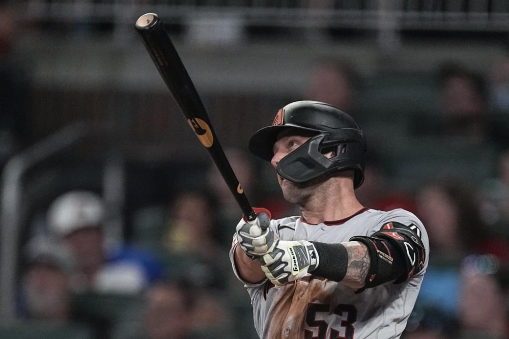 Arizona Diamondbacks' Christian Walker (53) watches his three-run home run in the sixth inning of a baseball game against the Atlanta Braves Tuesday, July 18, 2023, in Atlanta. (AP Photo/John Bazemore)
