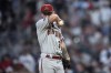 Arizona Diamondbacks starting pitcher Zach Davies (27) waits on the mound for manager Torey Lovullo to relieve him in the fourth inning of a baseball game against the Atlanta Braves Tuesday, July 18, 2023, in Atlanta. (AP Photo/John Bazemore)