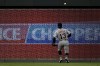 Detroit Tigers left fielder Eric Haase chases an RBI double hit by Kansas City Royals' Freddy Fermin during the fourth inning of a baseball game Tuesday, July 18, 2023, in Kansas City, Mo. (AP Photo/Charlie Riedel)