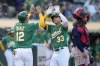Oakland Athletics' JJ Bleday (33) celebrates with Aledmys Díaz, left, after hitting a two-run home run against the Boston Red Sox during the second inning of a baseball game Tuesday, July 18, 2023, in Oakland, Calif. (AP Photo/Godofredo A. Vásquez)