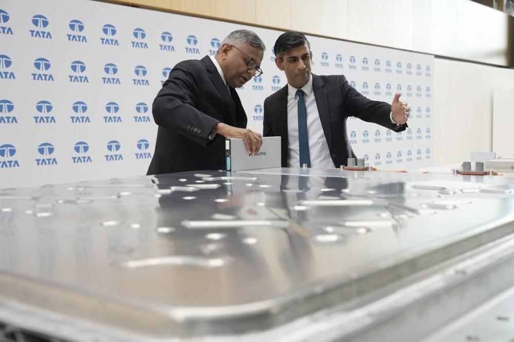 Britain's Prime Minister Rishi Sunak, right, and the Chairman of the Board at Tata, Natarajan Chandrasekaran, left, visit Land Rover in Warwick, Britain, Wednesday, July 19, 2023 for an announcement on an electric car battery factory. India’s Tata Sons has confirmed plans to build a 4-billion-pound, or $5.2-billion, electric car battery factory in the U.K. The plant is expected to become one of Europe’s largest battery cell manufacturing sites when it begins production in 2026. (Christopher Furlong/Pool via AP)