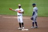 Baltimore Orioles' Ramon Urias, left, gestures as he stands on second after hitting a double during the third inning of a baseball game next to Los Angeles Dodgers second baseman Mookie Betts (50), Wednesday, July 19, 2023, in Baltimore. (AP Photo/Nick Wass)