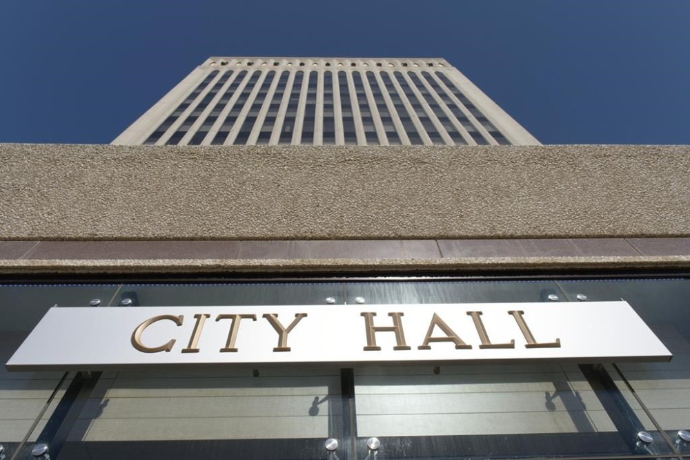Rina City Hall in Regina is pictured on Wednesday, April 5, 2023. Police say a woman has died from a suspected drug overdose at a homeless encampment outside city hall. THE CANADIAN PRESS/Michael Bell