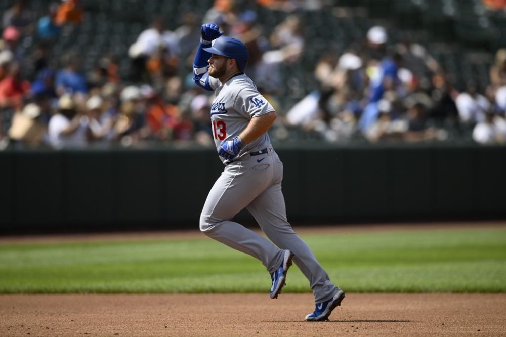 Los Angeles Dodgers' Max Muncy gestures as he rounds the bases on his two-run home run during the fifth inning of a baseball game against the Baltimore Orioles, Wednesday, July 19, 2023, in Baltimore. (AP Photo/Nick Wass)