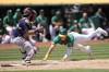 Boston Red Sox catcher Connor Wong, left, prepares to tag out Oakland Athletics' JJ Bleday at home during the fifth inning of a baseball game in Oakland, Calif., Wednesday, July 19, 2023. (AP Photo/Jeff Chiu)