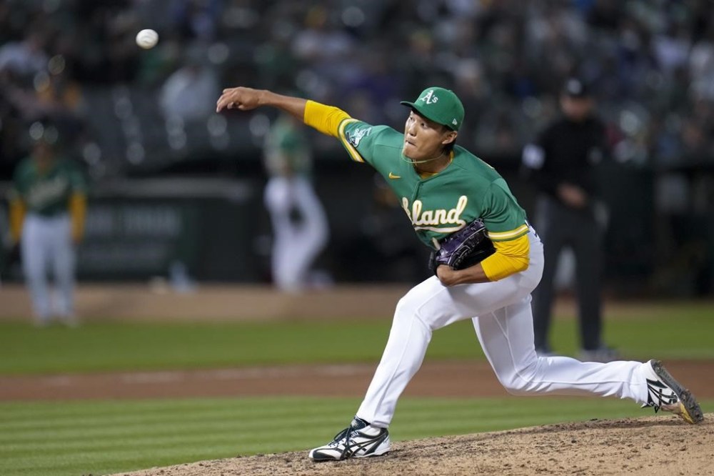Oakland Athletics pitcher Shintaro Fujinami throws to a Boston Red Sox batter during the seventh inning of a baseball game Tuesday, July 18, 2023, in Oakland, Calif. (AP Photo/Godofredo A. Vásquez)