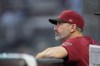 Arizona Diamondbacks manager Torey Lovullo watches from the dugout during the team's baseball game against the Atlanta Braves on Wednesday, July 19, 2023, in Atlanta. (AP Photo/John Bazemore)