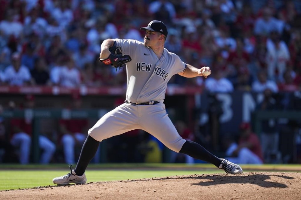 New York Yankees starting pitcher Carlos Rodon (55) throws during the second inning of a baseball game against the Los Angeles Angels in Anaheim, Calif., Wednesday, July 19, 2023. (AP Photo/Ashley Landis)