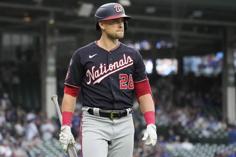 Washington Nationals' Lane Thomas walks back to the dugout after being called out on strikes during the first inning of the team's baseball game against the Chicago Cubs in Chicago, Wednesday, July 19, 2023. (AP Photo/Nam Y. Huh)