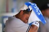 New York Yankees' Oswaldo Cabrera wipes off his head with a towel in the dugout during the fifth inning of a baseball game against the Los Angeles Angels in Anaheim, Calif., Wednesday, July 19, 2023. (AP Photo/Ashley Landis)