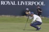 South Africa's Christo Lamprecht (amateur) looks at the line of his putt on the 18th green on the first day of the British Open Golf Championships at the Royal Liverpool Golf Club in Hoylake, England, Thursday, July 20, 2023. (AP Photo/Peter Morrison)