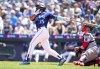 Seattle Mariners' Teoscar Hernandez follows through on a solo home run against the Minnesota Twins during the fourth inning of a baseball game, Thursday, July 20, 2023, in Seattle. (AP Photo/Lindsey Wasson)
