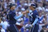 Chicago Cubs relief pitcher Adbert Alzolay, right, and catcher Miguel Amaya, left, celebrate after a win over the St. Louis Cardinals in a baseball game Friday, July 21, 2023, in Chicago. (AP Photo/Charles Rex Arbogast)