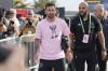 Inter Miami forward Lionel Messi, front left, arrives before a League Cup soccer match against Cruz Azul, Friday, July 21, 2023, in Fort Lauderdale, Fla. (AP Photo/Lynne Sladky)