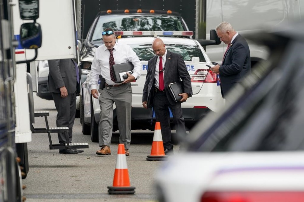 FILE - Authorities search the home of suspect Rex Heuermann, Tuesday, July 18, 2023, in Massapequa Park, As new details emerge about how police finally caught the alleged Gilgo Beach serial killer, they've also raised questions about whether investigators adequately pursued a key lead that may have helped solve the case sooner. (AP Photo/John Minchillo, File)