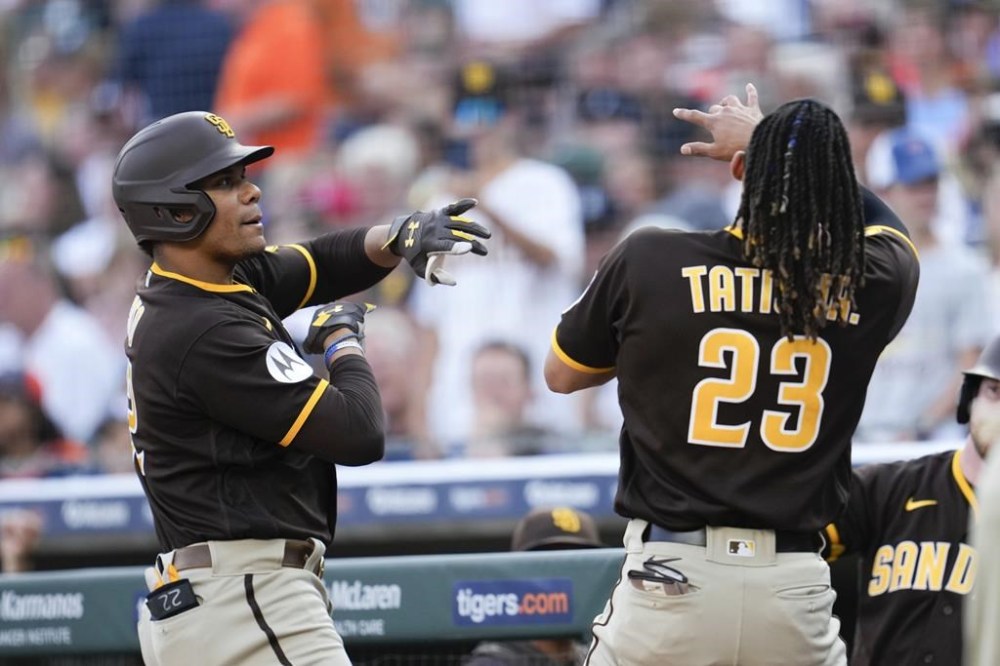 San Diego Padres' Juan Soto celebrates his home with with San Fernando Tatis Jr. (23) against the Detroit Tigers in the first inning of a baseball game, Friday, July 21, 2023, in Detroit. (AP Photo/Paul Sancya)