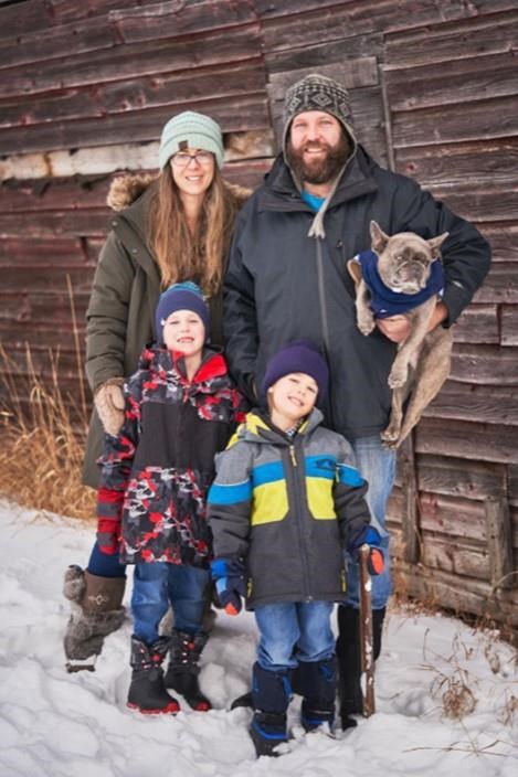 Carlyn and Ryan Gould and their sons Gus and Evan are shown in this undated handout photo. Ryan Gould, who died in a helicopter crash while fighting a forest fire in northern Alberta, is being remembered as a man with unforgettable humour. THE CANADIAN PRESS/HO, Kassy Goodyer *MANDATORY CREDIT*