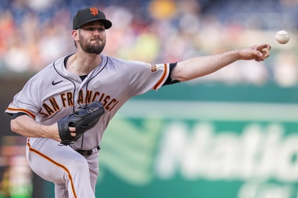 San Francisco Giants starting pitcher Alex Wood throws during the first inning of a baseball game against the Washington Nationals at Nationals Park, Friday, July 21, 2023, in Washington. (AP Photo/Alex Brandon)
