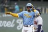 Milwaukee Brewers' William Contreras reacts after hitting an RBI double during the first inning of a baseball game against the Atlanta Braves Friday, July 21, 2023, in Milwaukee. (AP Photo/Morry Gash)
