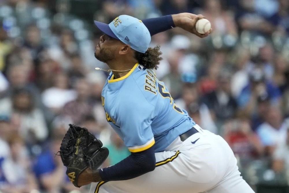 Milwaukee Brewers starting pitcher Freddy Peralta throws during the first inning of a baseball game against the Atlanta Braves Friday, July 21, 2023, in Milwaukee. (AP Photo/Morry Gash)
