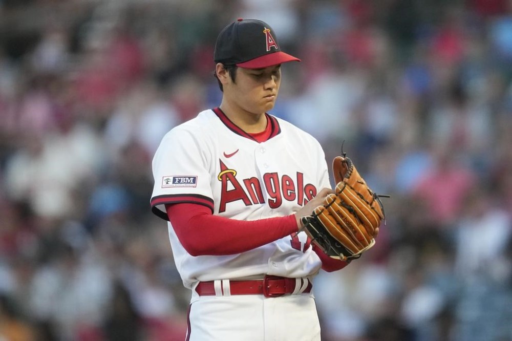 Los Angeles Angels starting pitcher Shohei Ohtani (17) reacts after a home run hit by Pittsburgh Pirates' Henry Davis during the fourth inning of a baseball game in Anaheim, Calif., Friday, July 21, 2023. (AP Photo/Ashley Landis)