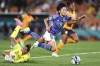 Japan's Riko Ueki, right, is fouled by Zambia's Catherine Musonda during the Women's World Cup Group C soccer match between Zambia and Japan in Hamilton, New Zealand, Saturday, July 22, 2023. (AP Photo/Juan Mendez)