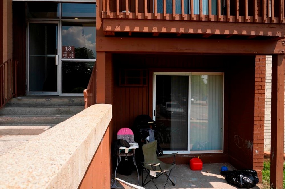 FILE - Children's equipment sits outside of an apartment, Wednesday, July 5, 2023, in Lansing, Mich. where Rashad Trice, 26, is accused of kidnapping Wynter Cole Smith, 2, after stabbing and assaulting her mother. Attorney General Dana Nessel charged Trice, 26, on Friday, July 21, with 20 counts, including one count each of first-degree premeditated murder and felony murder in Wynter Cole Smith's strangulation death. Both charges carry a mandatory life sentence without the possibility of parole. (Ryan Garza/Detroit Free Press via AP)