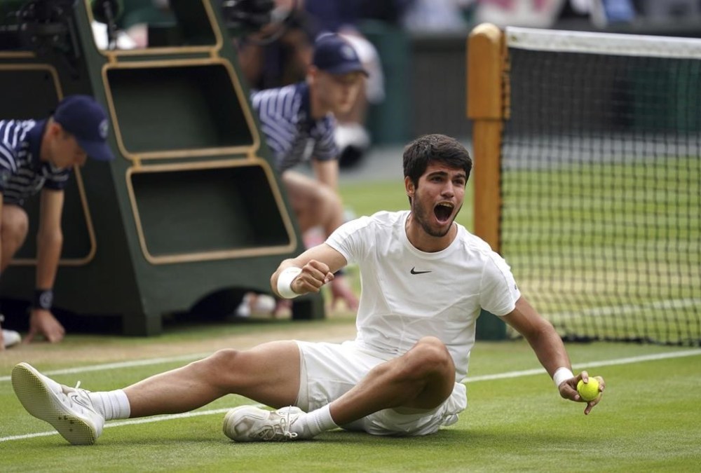 Spain's Carlos Alcaraz celebrates after beating Serbia’s Novak Djokovic to win the final of the men’s singles on day fourteen of the Wimbledon tennis championships in London, Sunday, July 16, 2023. (Victoria Jones/PA via AP)
