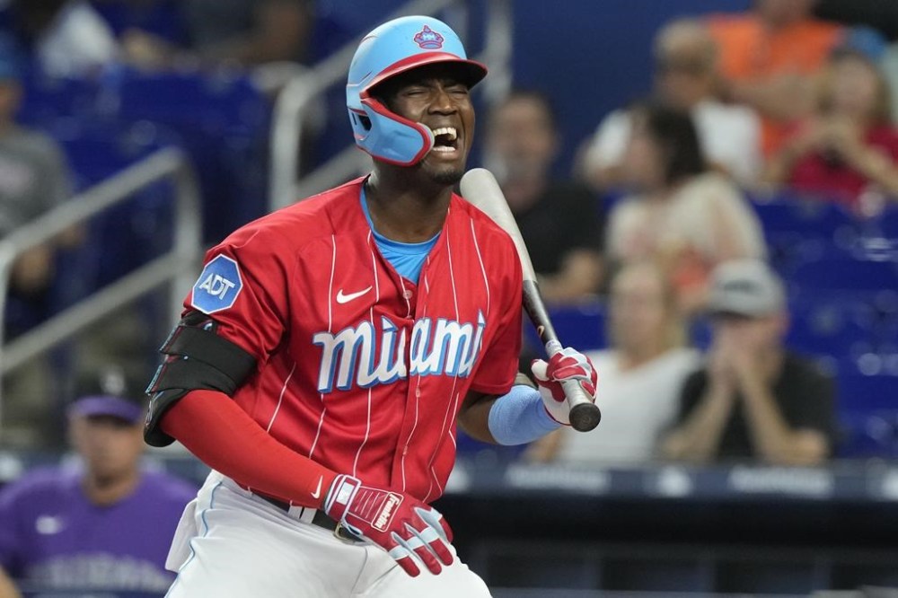 Miami Marlins' Jesus Sanchez reacts as a strike is called during the second inning of a baseball game against the Colorado Rockies, Saturday, July 22, 2023, in Miami. (AP Photo/Marta Lavandier)