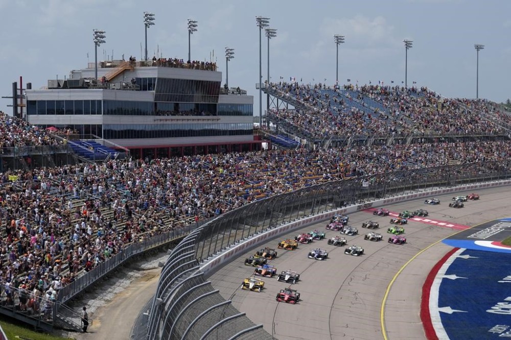 Will Power, of Australia, front right, leads the field at the start of an IndyCar Series auto race, Saturday, July 22, 2023, at Iowa Speedway in Newton, Iowa. (AP Photo/Charlie Neibergall)
