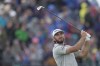 United States' Max Homa play his tee shot on the 4th hole during the third day of the British Open Golf Championships at the Royal Liverpool Golf Club in Hoylake, England, Saturday, July 22, 2023. (AP Photo/Kin Cheung)