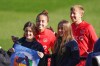 Canada's Julia Grosso, left, and Quinn pose for a photo with supporters during a training session ahead of the FIFA Women's World Cup in Melbourne, Australia, Monday, July 17, 2023. Canada may be Olympic champion but it trails Vietnam, the Philippines and just about every other side at the FIFA Women's World Cup in one important category. THE CANADIAN PRESS/Scott Barbour