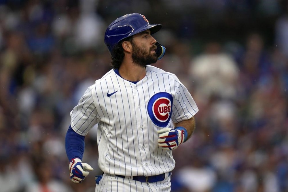 Chicago Cubs' Dansby Swanson heads to first after he was hit by a pitch in the sixth inning of a baseball game against the St. Louis Cardinals, Saturday, July 22, 2023, in Chicago. (AP Photo/Erin Hooley)