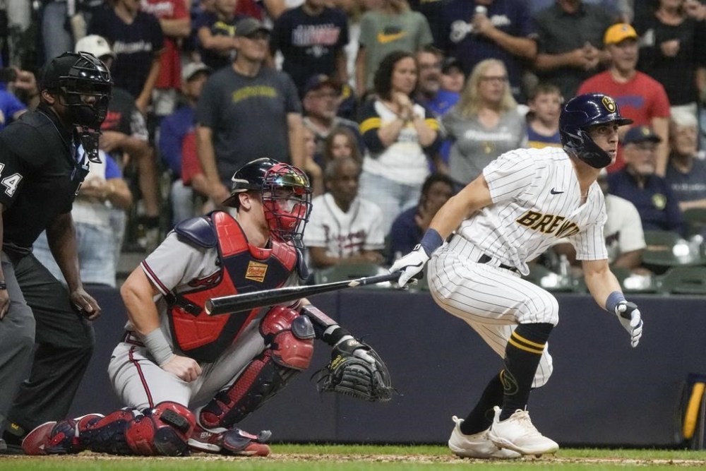 Milwaukee Brewers' Sal Frelick hits a sacrifice fly during the eighth inning of a baseball game Saturday, July 22, 2023, in Milwaukee. (AP Photo/Morry Gash)