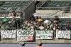 Fans sit behind signs hanging in right field at Oakland Alameda Coliseum during a baseball game between the Oakland Athletics and the Houston Astros in Oakland, Calif., Saturday, July 22, 2023. (AP Photo/Jeff Chiu)